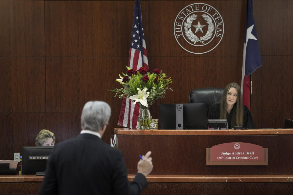 Judge Andrea Beall listens to Philip Hilder, a defense attorney for Texas Attorney General Ken Paxton, during a hearing in Paxton's securities fraud case, Friday, Feb. 16, 2024, at the Harris County criminal courthouse in Houston. Beall rejected Paxton’s attempts to throw out felony securities fraud charges that have shadowed the Republican for nearly a decade. (Jon Shapley/Houston Chronicle via AP)