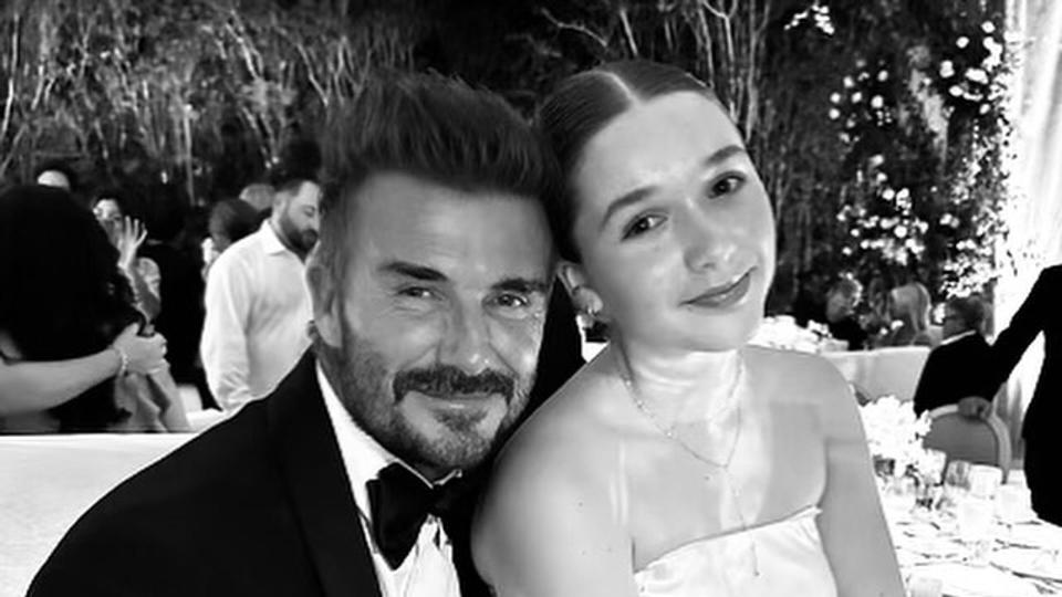 David Beckham and his daughter Harper at a wedding