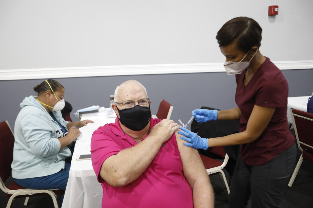 A pensioner is vaccinated in Tampa, Florida.