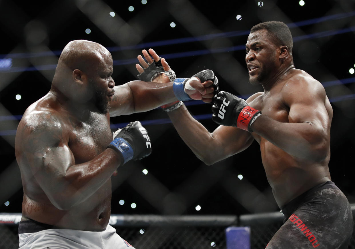 Francis Ngannou, right, fights Derrick Lewis during a heavyweight mixed martial arts bout at UFC 226, Saturday, July 7, 2018, in Las Vegas. (AP)