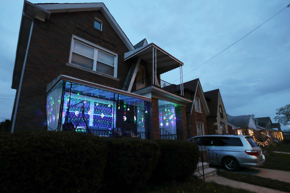 In this Tuesday, April 28, 2020 photo, Ramadan lights are displayed on a house in Dearborn, Mich. The Muslim community in Dearborn is starting a new tradition this year. The community is hosting a Ramadan lights competition in hopes of spreading joy and bringing back some of the holiday spirit during the coronavirus pandemic. (AP Photo/Carlos Osorio)