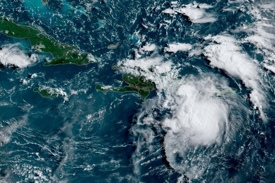 This satellite image provided by the National Oceanic and Atmospheric Administration (NOAA) shows a Tropical Storm Fred in the Caribbean as it passes south of Puerto Rico and the Dominican Republic at 8am EST, Wednesday, Aug. 11, 2021.