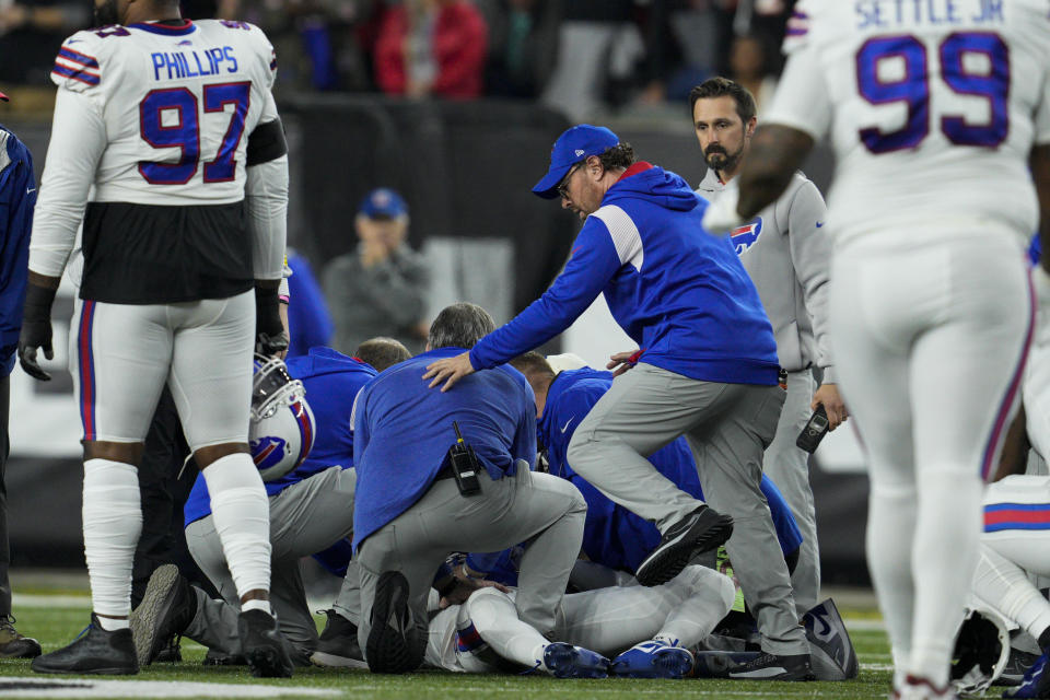 Buffalo Bills' Damar Hamlin is examined during the first half of an NFL football game against the Cincinnati Bengals, Monday, Jan. 2, 2023, in Cincinnati. (AP Photo/Jeff Dean)