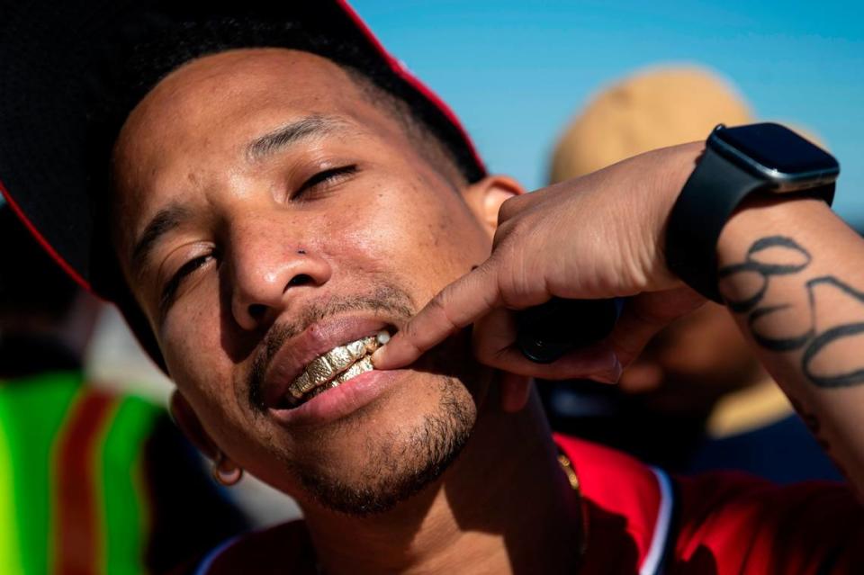 Trey Calloway, of Crestview, Florida, shows off his grill during Black Spring Break in Biloxi on Saturday, April 9, 2022.