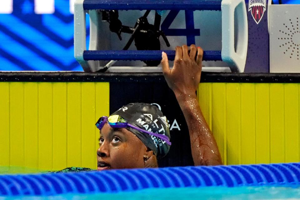 Simone Manuel reacts after swimming in the 50 freestyle during the U.S. Olympic Team Trials in Omaha.