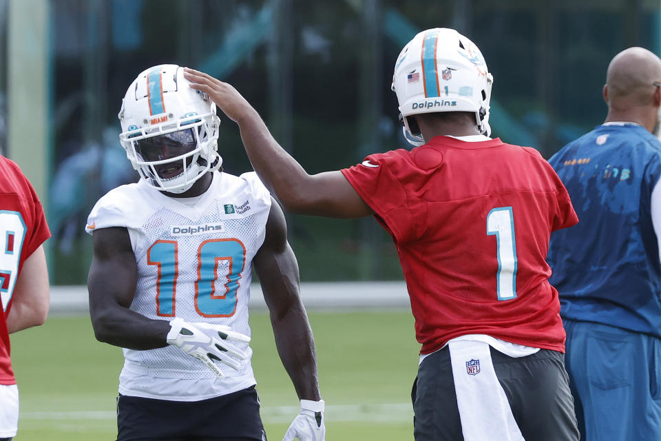 Miami Dolphins quarterback Tua Tagovailoa (1) and Tyreek Hill (10) will be teaming up this season. (Photo by Joel Auerbach/Getty Images)