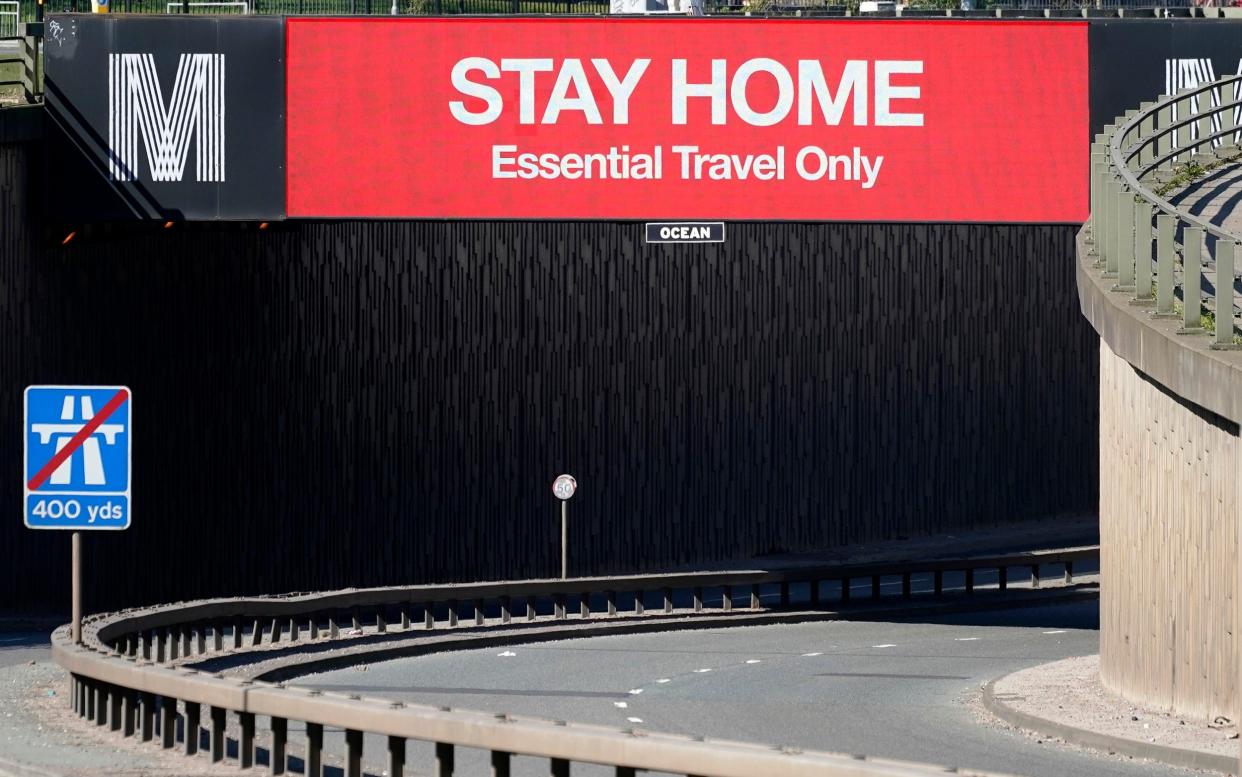 A giant television over the A57 Motorway screen urges people to stay home on March 26, 2020 in Manchester, England - Getty