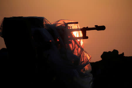 A heavy machine gun on the Iraqi side of the border with Syria at al-Qaim, Iraq, November 25, 2018. REUTERS/Alaa al-Marjani