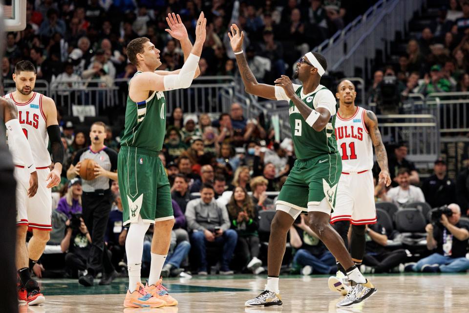 Bobby Portis (9) celebrates a third-quarter bucket with Brook Lopez (11).