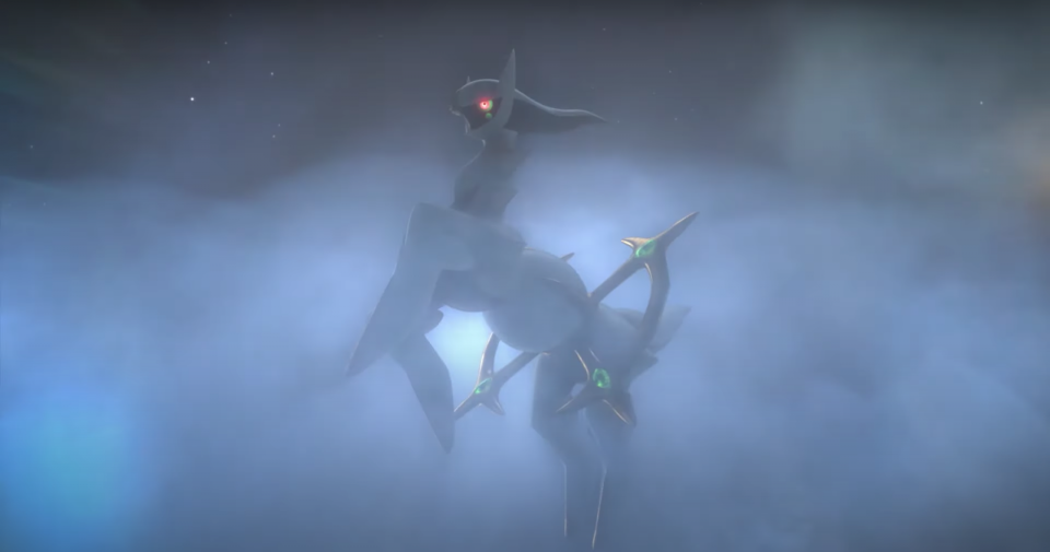 A hazy shot of Arceus behind in misty clouds in Pokémon Legends: Arceus.