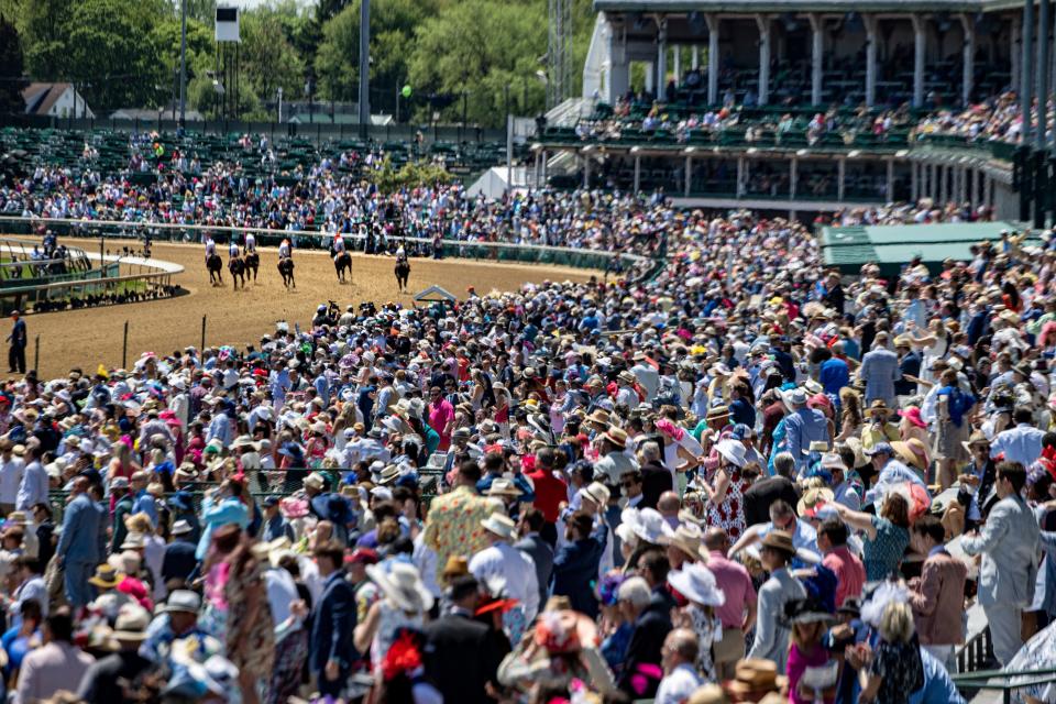 The crowd watches the end of the seventh race on the day of the 147th Kentucky Derby at Churchill Downs. May 1, 2021