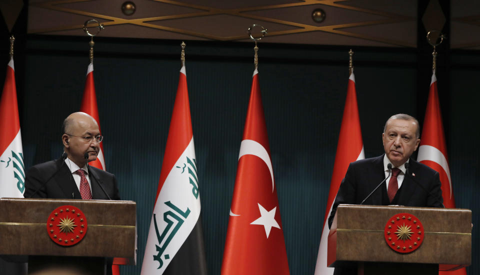 Turkey's President Recep Tayyip Erdogan, right, and Iraq's President Barham Salih speak to the media after their talks in Ankara, Turkey, Thursday, Jan. 3, 2019. The two expected to discus bilateral and regional issues, including Syria. (AP Photo/Burhan Ozbilici)