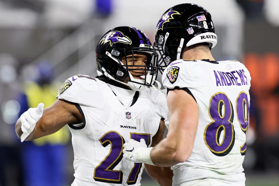 Baltimore Ravens running back J.K. Dobbins (27) celebrates with tight end Mark Andrews (89) after Dobbins scored a one-yard touchdown during the second half of an NFL football game against the Cleveland Browns, Monday, Dec. 14, 2020, in Cleveland. (AP Photo/Ron Schwane)