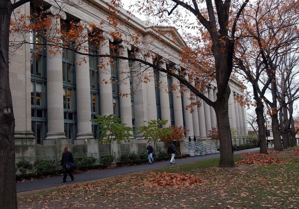 Students walk through the Harvard Law School area on the campus of Harvard University in Cambridge.