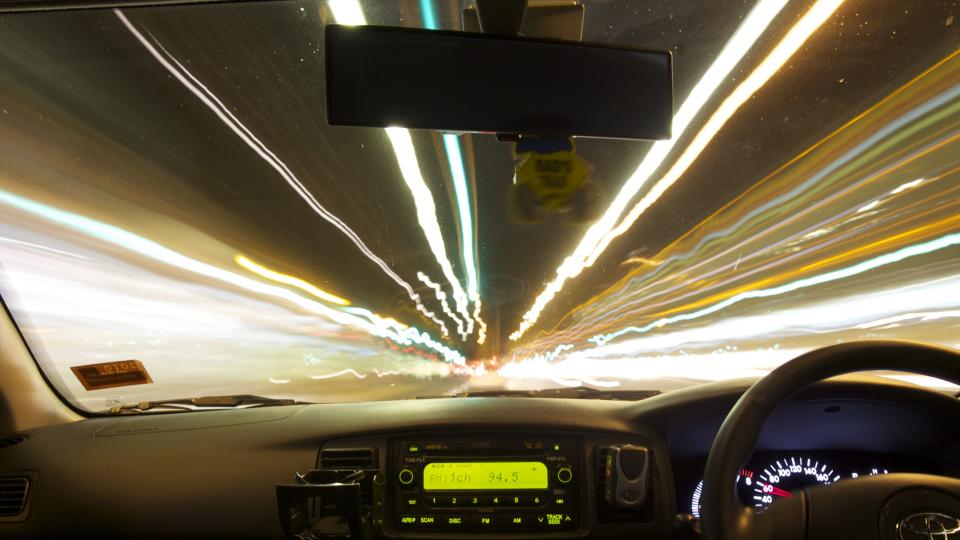 A car pictured driving through a tunnel with blurred lights. Experts argue Australians shouldn't discriminate against drivers of a certain age.