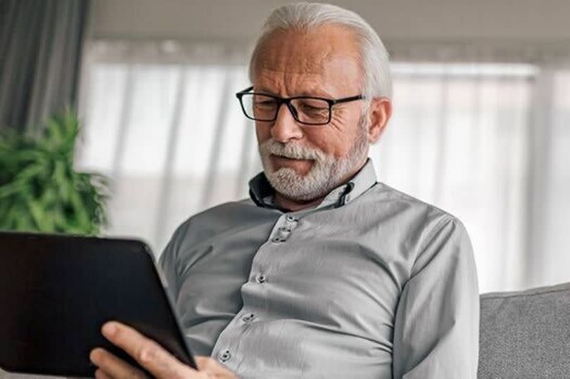 A man checks his finances