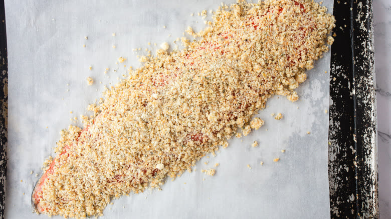 salmon crusted with parmesan on baking sheet