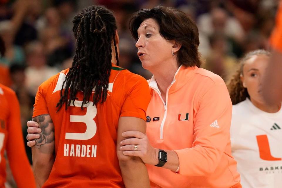 Mar 26, 2023; Greenville, SC, USA; Miami Hurricanes head coach Katie Meier talks with Miami Hurricanes forward Destiny Harden (3) during a time out against the LSU Lady Tigers during the NCAA Women’s Tournament at Bon Secours Wellness Arena.