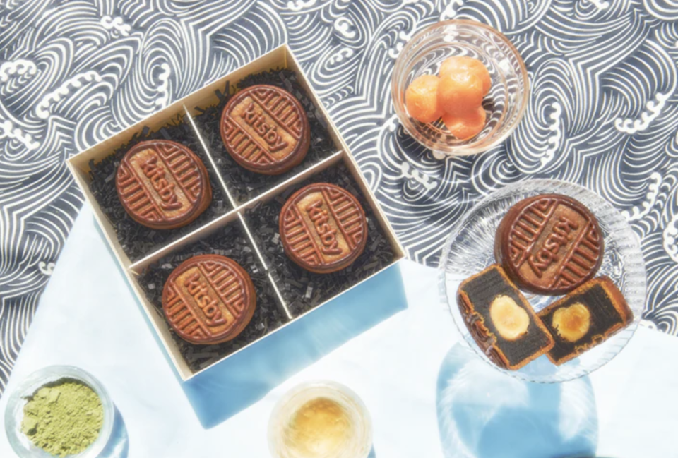 Four mooncakes with the word Kitsby stamped across in a box.