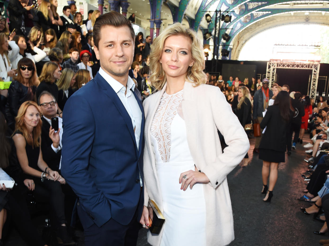 LONDON, ENGLAND - SEPTEMBER 19:  Rachel Riley (R) and Pasha Kovalev attend the Julien MacDonald Spring/Summer 2016 Collection during London Fashion Week at Smithfields Market on September 19, 2015 in London, England.  (Photo by David M. Benett/Getty Images for Julien MacDonald)