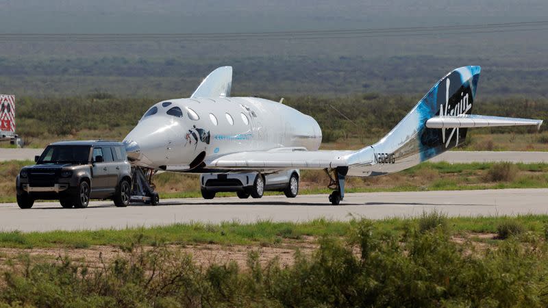 FILE PHOTO: Virgin Galactic's passenger rocket plane VSS Unity is towed after reaching the edge of space above Spaceport America