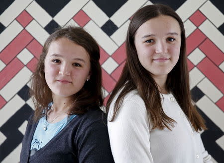 Twins Edita (L) and Elma Pajalic pose for a portrait at a secondary school in Buzim, April 2, 2015. Nedzib Vucelj, a former teacher and journalist, has launched an initiative to declare Buzim the "Town of Twins". REUTERS/Dado Ruvic