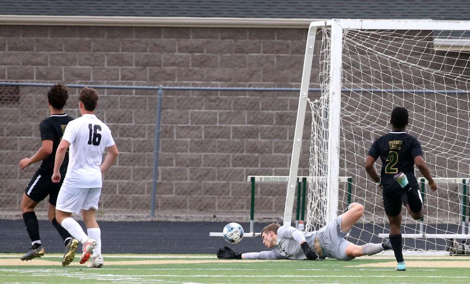 Iowa City West’s Jacob Gilliam (1) defends the goal against Waterloo West on Thursday, May 2 in Iowa City, Iowa.