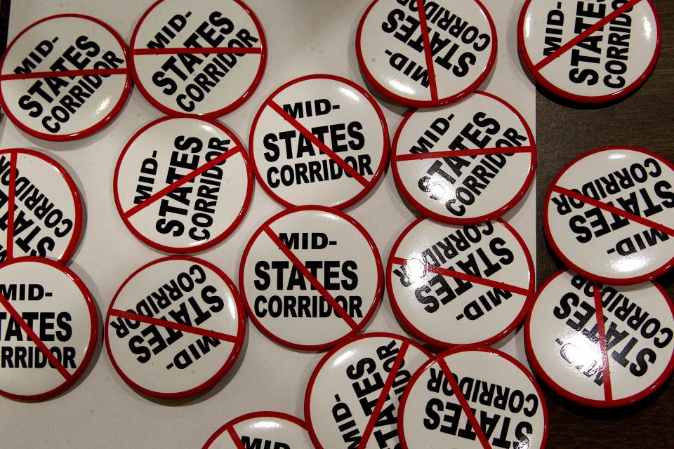 Anti-Mid-States Corridor buttons were available at the public town hall in Mitchell Thursday evening.