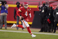 Kansas City Chiefs quarterback Chad Henne scrambles up field during the second half of an NFL divisional round football game against the Cleveland Browns, Sunday, Jan. 17, 2021, in Kansas City. (AP Photo/Charlie Riedel)