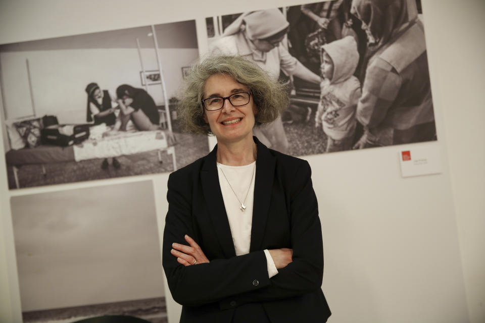 FILE -- Sister Nathalie Becquart poses for a photo during an interview with the Associated Press in Rome, Wednesday, Feb. 10, 2021. In 2021 Pope Francis appointed Becquart as undersecretary of the Synod of bishops' Organizing Secretariat, a job which by its office entitled her to a vote but which had previously only been held by a man. At previous synods, women were only allowed more marginal roles of observers or experts, literally seated in the last row of the audience hall while the bishops and cardinals took the front rows and voted. In the upcoming synod starting Oct. 4, all participants will be seated together at hierarchically neutral round tables to facilitate discussion. (AP Photo/Alessandra Tarantino, File)