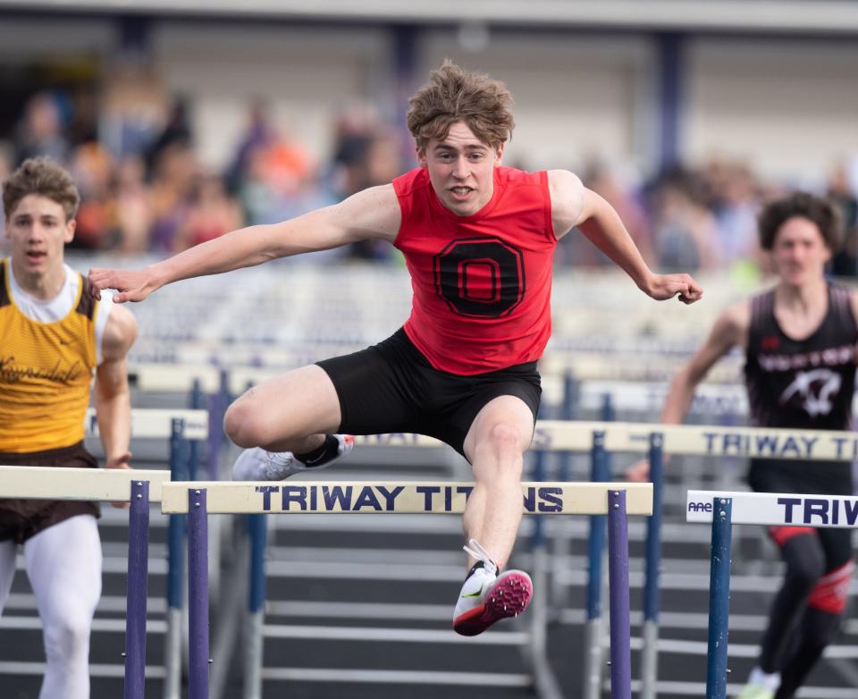 Calvin Speicher wins the 110 Meter Hurdles for Orrville.