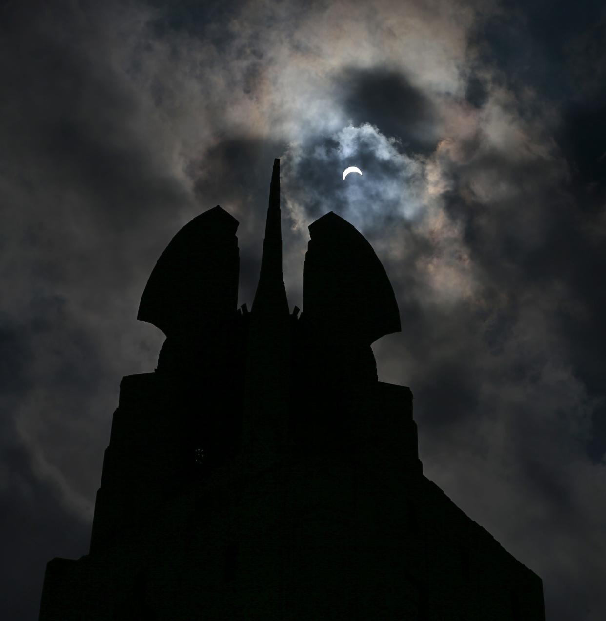 The "Wings of Progress" atop the Times Square Building during a solar eclipse on Aug. 21, 2017.