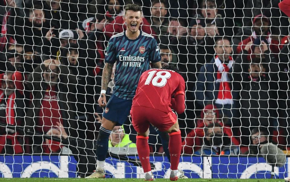 Arsenal defender Ben White reacts after Liverpool's Takumi Minamino shoots over the bar during the Carabao Cup Semi Final First Leg - Getty Images