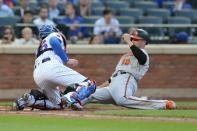 Jun 5, 2018; New York City, NY, USA; Baltimore Orioles first baseman Chris Davis (19) is tagged out trying to score by New York Mets catcher Kevin Plawecki (26) during the second inning at Citi Field. Mandatory Credit: Brad Penner-USA TODAY Sports