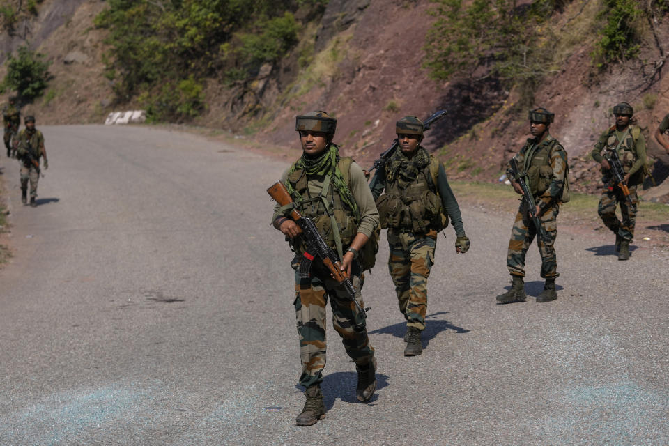 Indian army soldiers patrol the area where a bus fell into a deep gorge on Sunday after being fired at by suspected militants in Reasi district, Jammu and Kashmir, Monday, June 10, 2024. The bus was carrying pilgrims to the base camp of the famed Hindu temple Mata Vaishno Devi when it came under attack killing at least nine people. (AP Photo/Channi Anand)