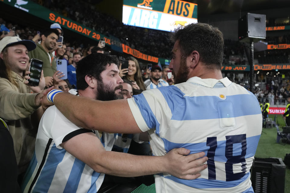 Argentina's Eduardo Bello, right, is congratulated by a spectator following the Rugby Championship test match between Australia and Argentina in Sydney, Australia, Saturday, July 15, 2023. (AP Photo/Rick Rycroft)