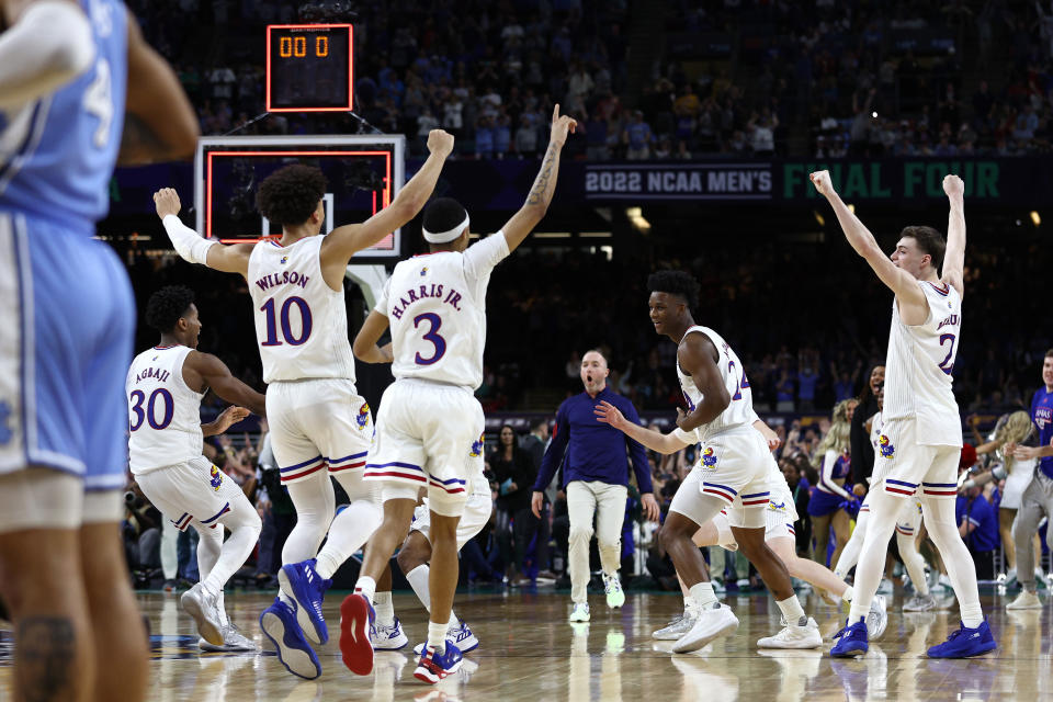 NEW ORLEANS, LOUISIANA - APRIL 04: Kansas Jayhawks players react after defeating the North Carolina Tar Heels 72-69 during the 2022 NCAA Men's Basketball Tournament National Championship at Caesars Superdome on April 04, 2022 in New Orleans, Louisiana. (Photo by Tom Pennington/Getty Images)