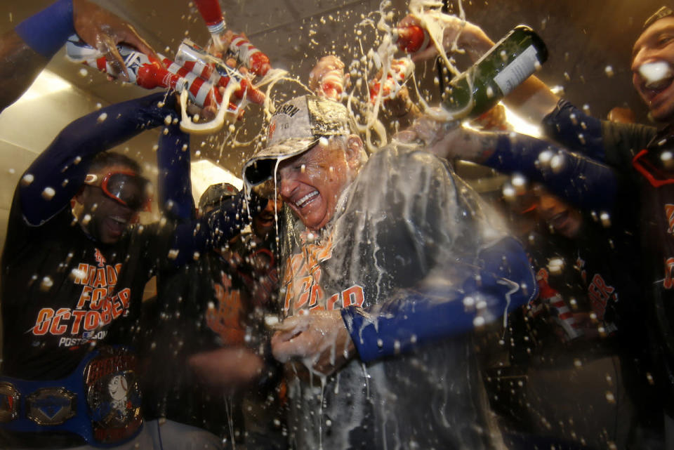 Terry Colllins is doused with champagne