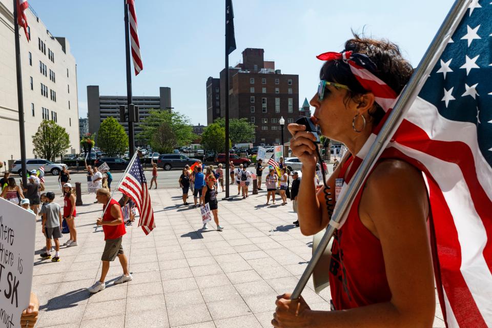 Anti-vaccine mandate protesters demonstrate, on August 24, 2021, outside of the Ohio Statehouse in Columbus. (Photo by STEPHEN ZENNE /AFP)