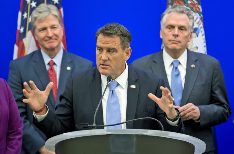 State Sen. Bryce Reeves at center, with Virginia Gov. Terry McAuliffe, right, and Virginia secretary of public safety Brian Moran, left