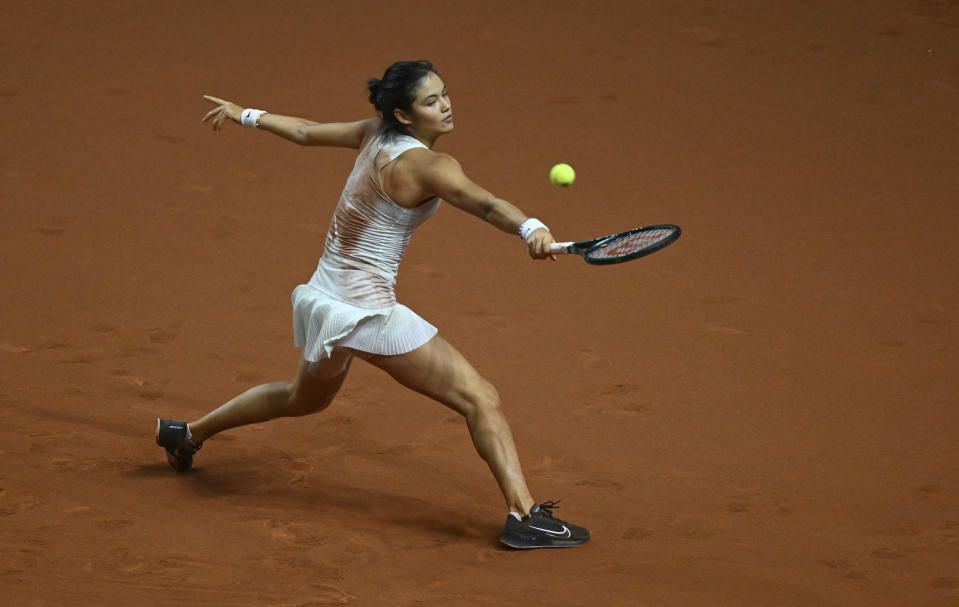 Britain's Emma Raducanu plays Poland's Iga Swiatek during her quarterfinals tennis match at the WTA Tour in Stuttgart, Germany, Friday April 19, 2024. (Marijan Murat/dpa via AP)