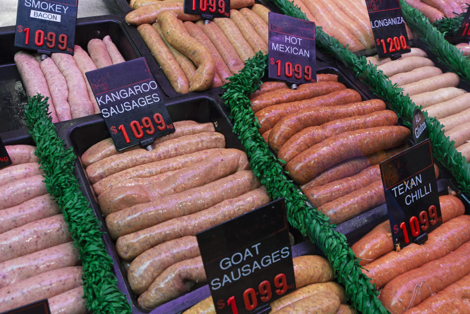 Rows of sausages in a butcher's shop including kangaroo sausages.