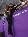 <p>Canada’s Scott Moir leaps up into the stands to celebrate with teammates after he and partner Tessa Virtue won the gold medal in the ice dance, free dance figure skating final in the Gangneung Ice Arena at the 2018 Winter Olympics in Gangneung, South Korea, Tuesday, Feb. 20, 2018. (AP Photo/David J. Phillip) </p>