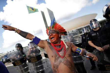 Brazilian Indians take part in a demonstration against the violation of indigenous people's rights, in Brasilia, Brazil April 25, 2017. REUTERS/Ueslei Marcelino