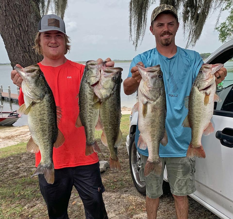 Garrett Foster, left, and Weston Smith had 25.49 pounds to win first place in the Polk County Bass AssassinÕs tournament May 21 on Lake Alfred.  