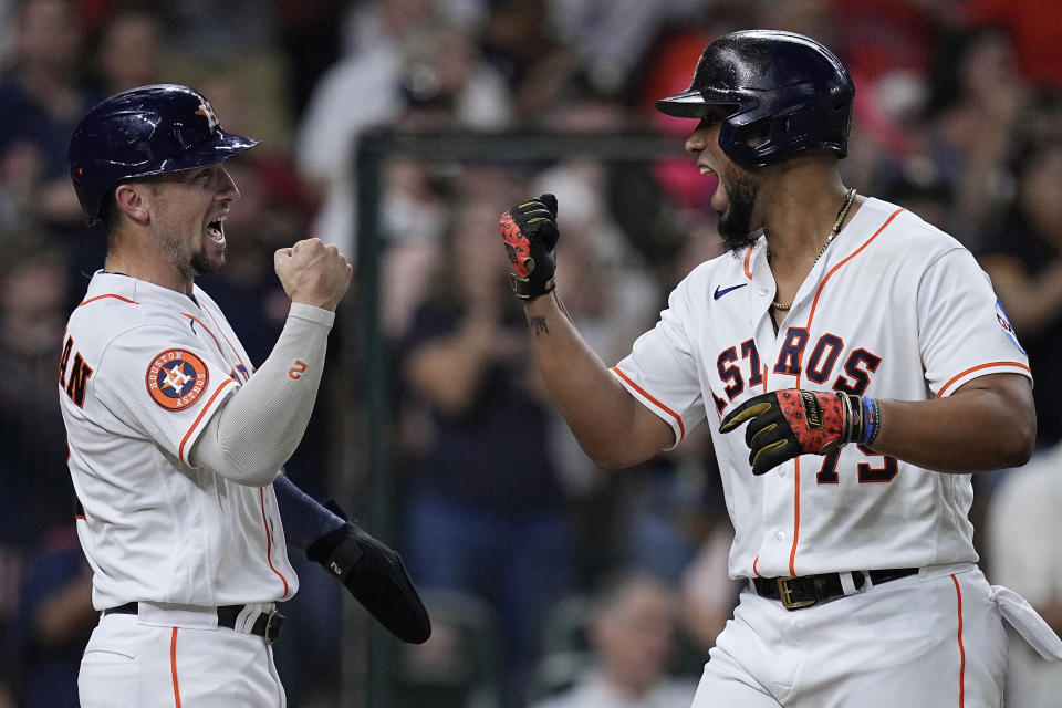 Houston Astros' Jose Abreu, right, celebrates with Alex Bregman (2) after hitting a three-run home run against the Tampa Bay Rays during the sixth inning of a baseball game Saturday, July 29, 2023, in Houston. (AP Photo/Kevin M. Cox)