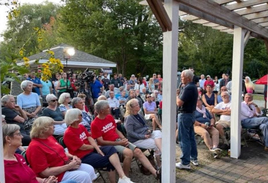 A crowd listens to former Vice President Mike Pence, a candidate in the GOP presidential primary, during a stop in Rye, NH on Monday, Sept. 4.
