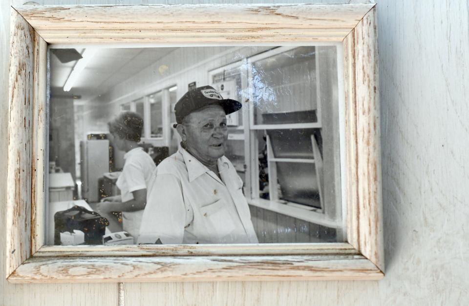 A photo of H.L Britt hangs on the wall at Britt's Donut Shop in Carolina Beach. Britt opened the shop on the Carolina Beach Boardwalk in 1939 before selling it to current owner Bobby Nivens in 1974.