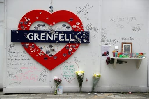 Messages of condolence can be seen near Grenfell tower