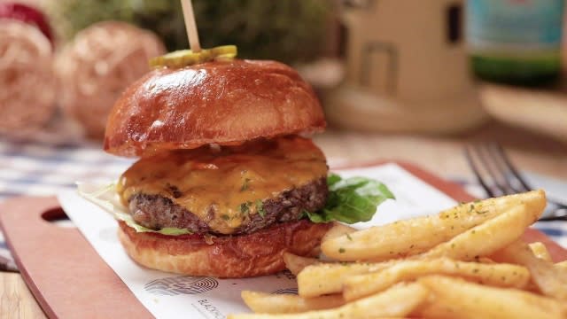 Classic beef burger from working title with a side of fries